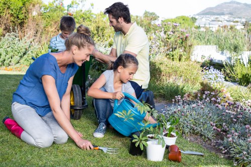 Community volunteers loading donated garden tools into a van